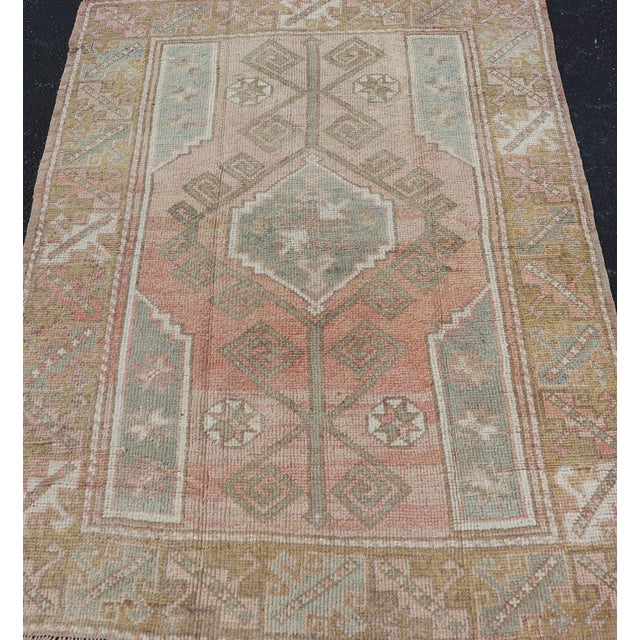 Measures: 4'2"X5'10" Vintage Turkish Oushak Rug With Faded Rose, Olive Green, and Soft Beige Accents 4'2"x5'10". Antique...