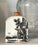 This is a flat-sided, arched-top ceramic snuff bottle—a popular collectible form that originated during the Qing Dynasty....