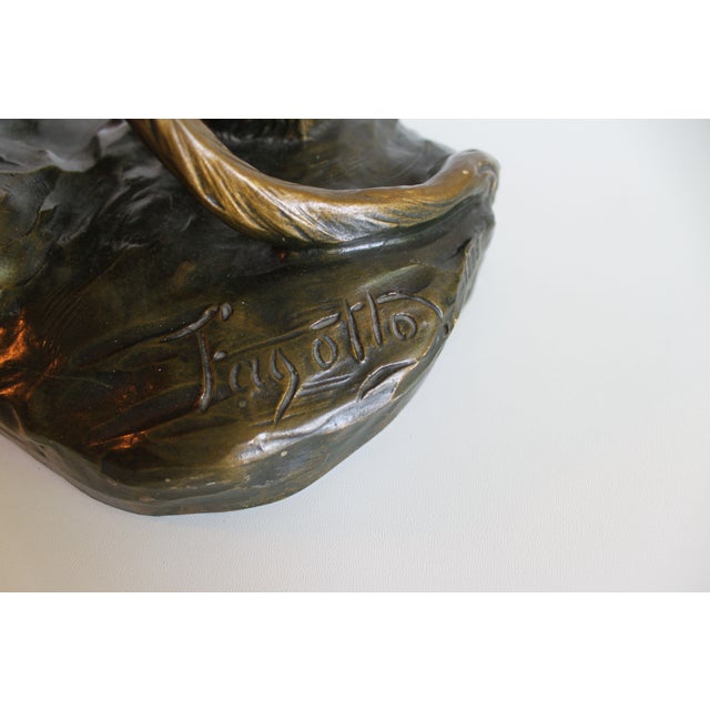 Terracotta sculpture by Armand Fagotto representing a lioness, the quality of the details is striking, its strength and...