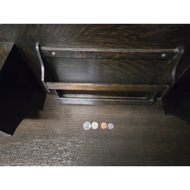 This Arts & Crafts-style writing desk was made by Oscar Onken & Company of Cincinnati, Ohio (see photo of maker's label...