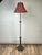This elegant antique floor lamp by Rembrandt reflects the sophisticated blend of classical influence and early Art Deco...