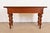 Baker Furniture Colonial West Indies Carved Mahogany Console Table features distinctive turned legs and dovetailed...
