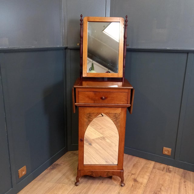 Elegant Edwardian shaving and bathroom vanity from circa 1900-1910, crafted from mahogany. Features a tilting mirror,...