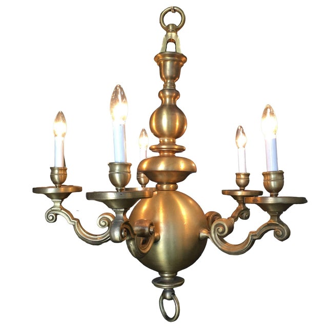 English Georgian-style chandelier is hand crafted from heavy solid brass, showcasing a beautifully aged golden patina and...