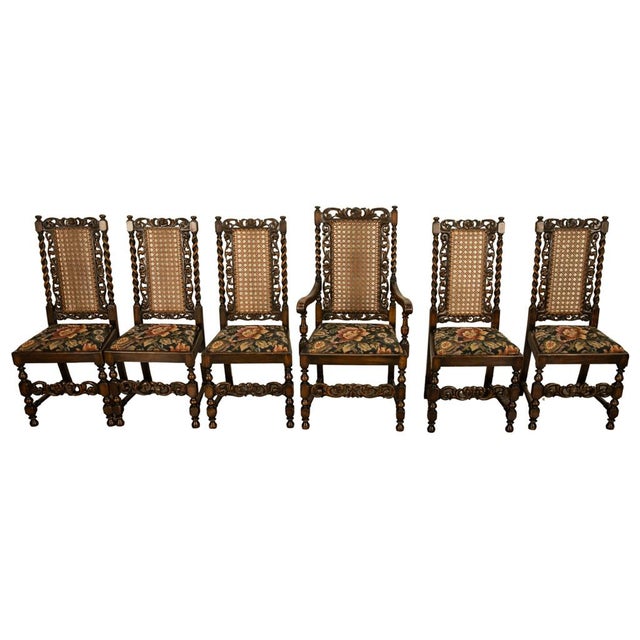 An exceptional and highly decorative set of six antique carved walnut Jacobean Revival dining chairs in excellent...
