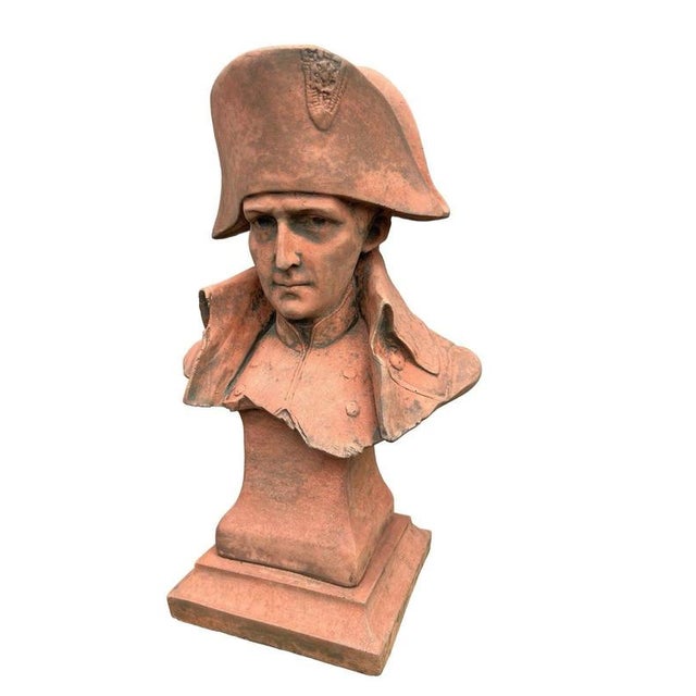A striking sculptural bust of Napoleon Bonaparte, depicted in his unmistakable bicorne hat and military uniform. The...