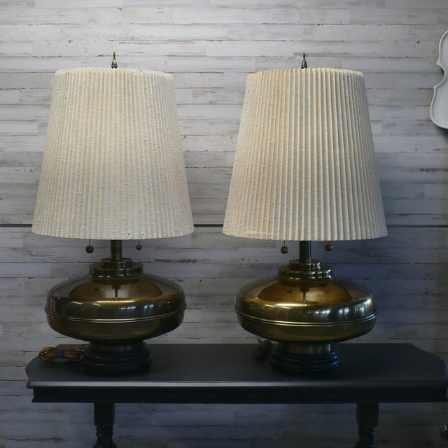 Elevate your home with this exceptional matched pair of authentic Marbro table lamps. This impressive pair features a...