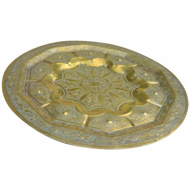Hand-hammered and engraved in Fez, Morocco. Features an ornate Arabesque design and intricate details. This beautiful...