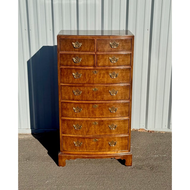Vintage Henredon Georgian-style bow-front highboy chest of drawers in figured mahogany with brass hardware. Four short...