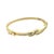 A sculptural gold bangle from around 1980, this 14K yellow gold bracelet carries channel-set baguette diamonds in a...