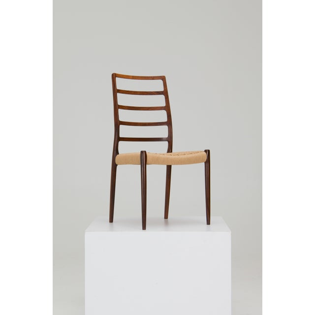 A set of 8 dining chairs, model no. 82, designed by niels o. Møller in the 1960s for his own company, j.l. Møllers...