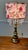 This lamp is a classic, decorative style combining vintage elements with a nature-inspired modern designed shade. It...