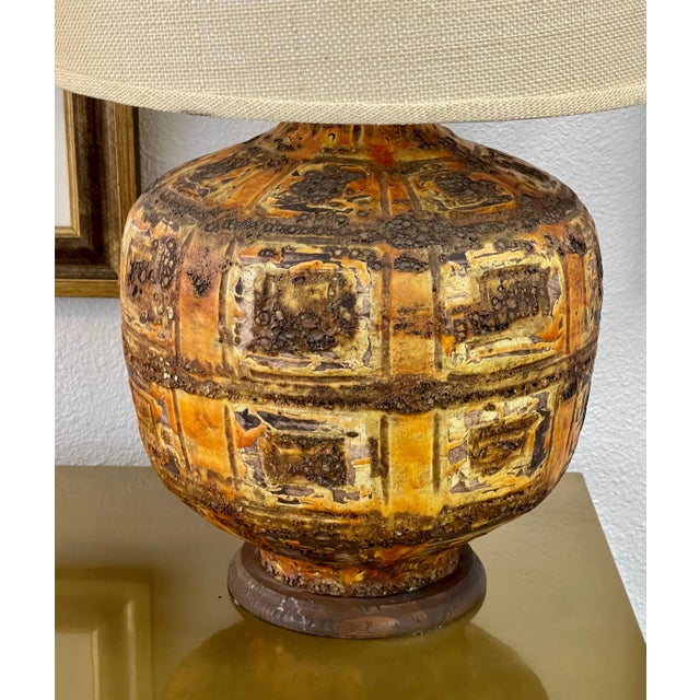 A nice vintage ceramic volcanic lava glaze lamp. Lamps has been rewired with new electrical fittings. Some wear to the...