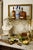A beautifully crafted solid brass tassel wall shelf with an inset glass top, featuring rope‑and‑swag detailing and classic...