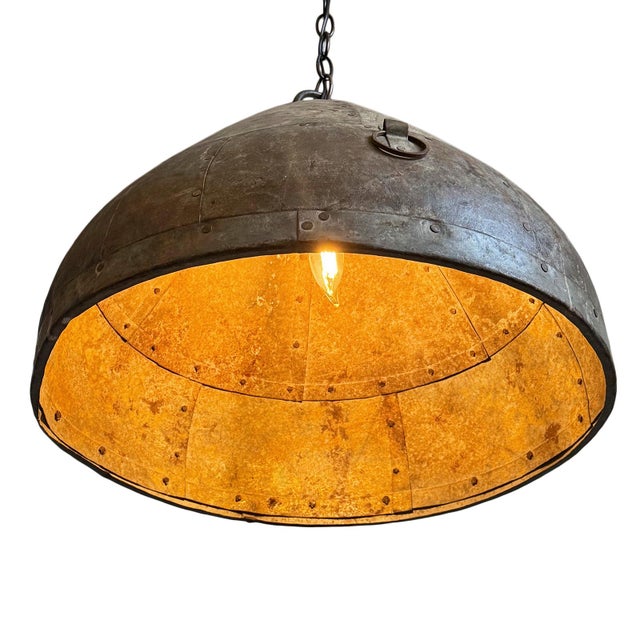 Vintage iron pendant light crafted from a hand-forged bowl from early–mid 20th century India. Such vessels were...