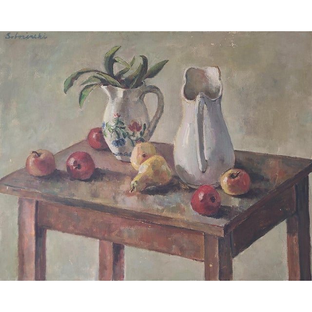 Vintage still-life oil painting depicting apples, pears and two ceramic pitchers on a rustic table. Original and one of a...