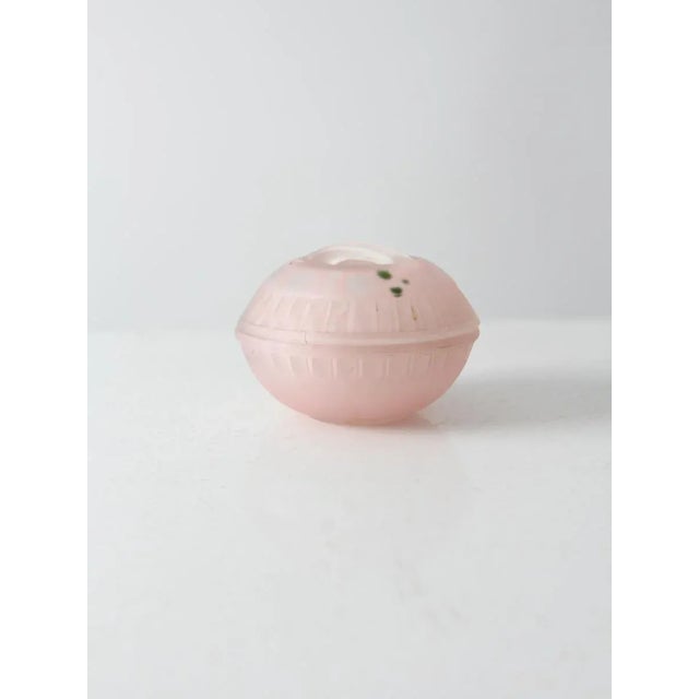 A charming vintage satin glass lidded candy dish adorned with delicate hand-painted floral details. This round frosted...