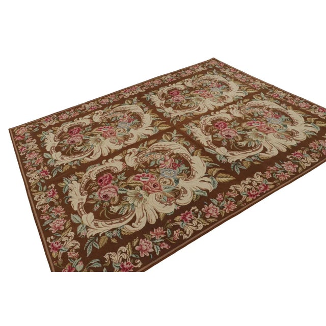 Handwoven in wool, this 7x9 flatweave rug “Acanthus” from China features floral patterns that are often seen in botanical...