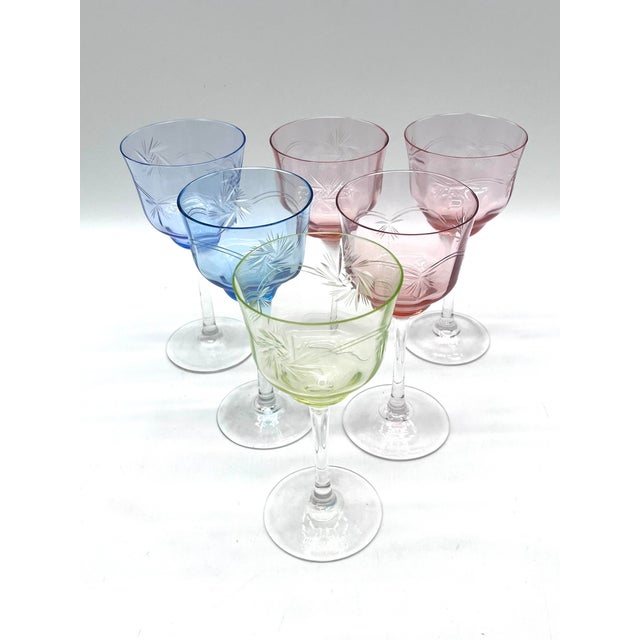 Elegant set of six handcrafted Römer wine glasses with a decorative star design. The glasses impress with their vibrant,...