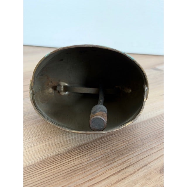 vintage hand-painted brass or metal cowbell souvenir, likely originating from Switzerland or the Alpine region, featuring...