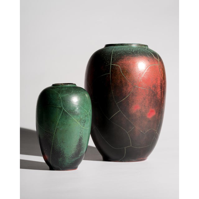 An exceptional curated pair of studio ceramic vases from the Grootenburg pottery workshop of German ceramic artist Paul...
