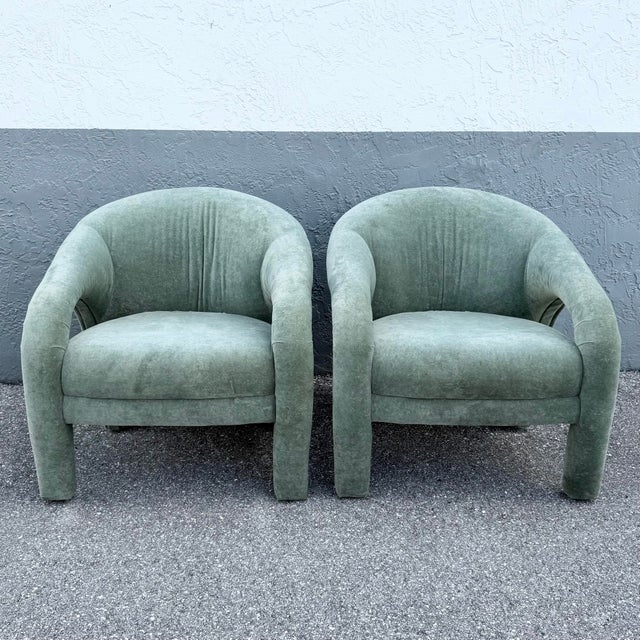 A striking pair of postmodern sculptural lounge chairs upholstered in luxurious sage mint green velvet. Defined by their...