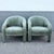 A striking pair of postmodern sculptural lounge chairs upholstered in luxurious sage mint green velvet. Defined by their...