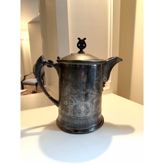 Set of three antique Victorian quadruple plated silver pieces from Louisiana estate includes: Baroque style water pitcher...
