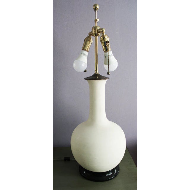 Illuminate your space with this stunning, large Christopher Spitzmiller lamp. Featuring a matt finish blanc de chine...