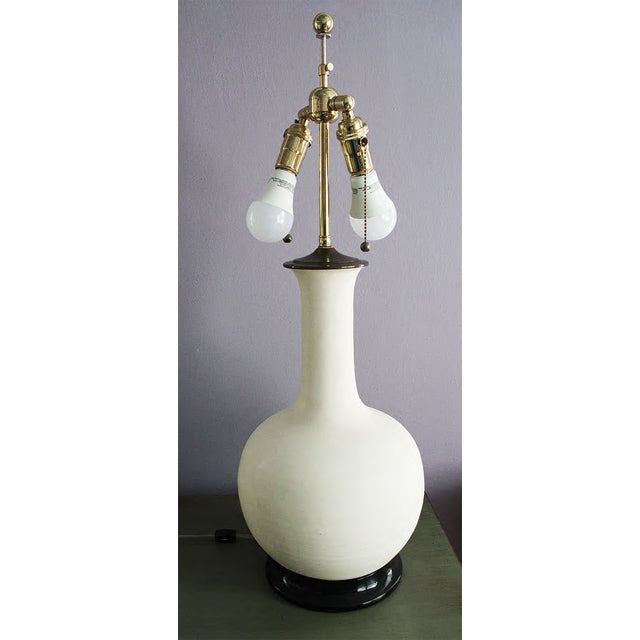 Illuminate your space with this stunning, large Christopher Spitzmiller lamp. Featuring a matt finish blanc de chine...