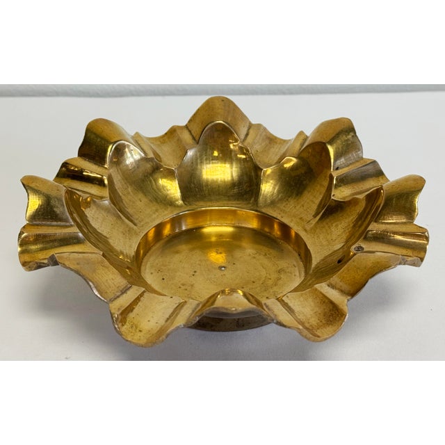 Vintage Hollywood Regency style tiered scalloped brass dish with nice detail and a gorgeous patina. This would make a...