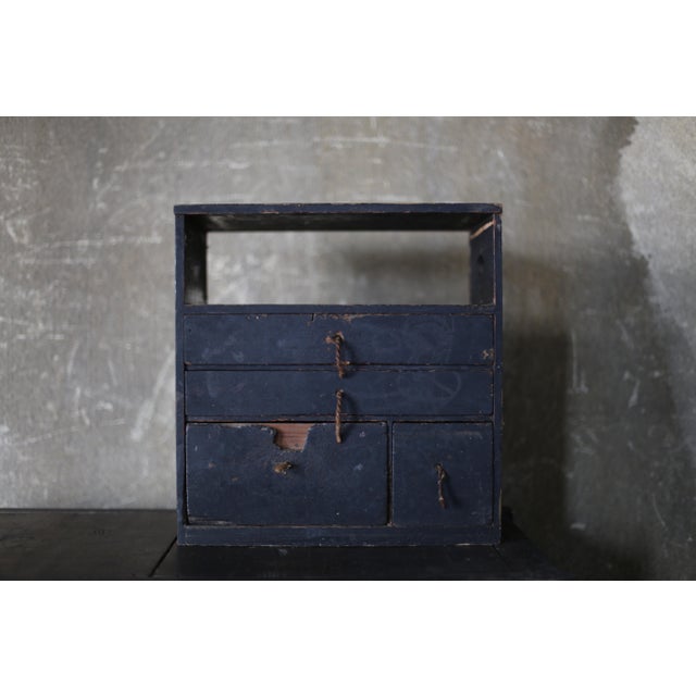 This is a very old black-lacquered drawer storage unit made in Japan. The original handles still have old ropes attached,...