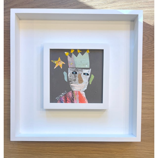 Mixed media collage on cradled wood panel, framed in a duo style white wooden frame, 13 x 13 x 1.5. Back wired, ready to...