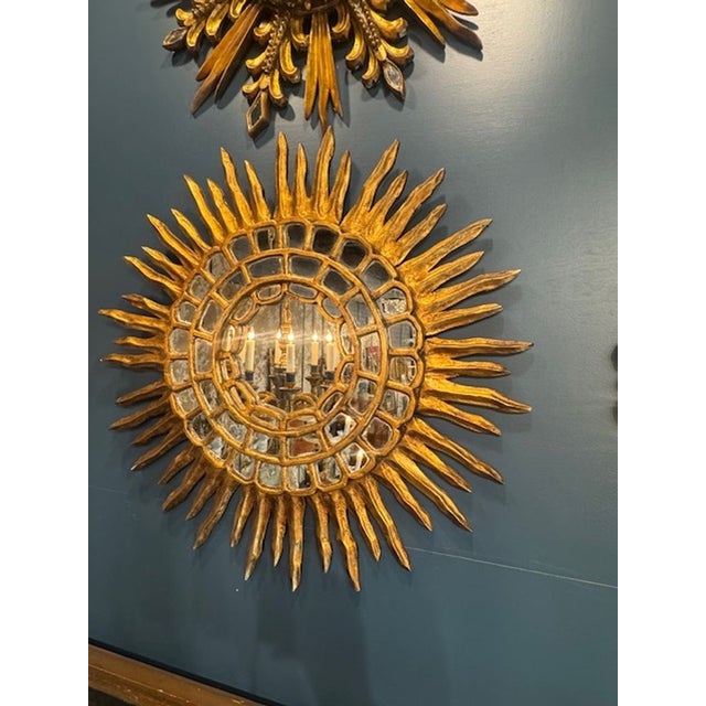 Vintage Italian carved and gilt-wood sunburst mirror. Very stunning in person and perfect for any elegant environment....