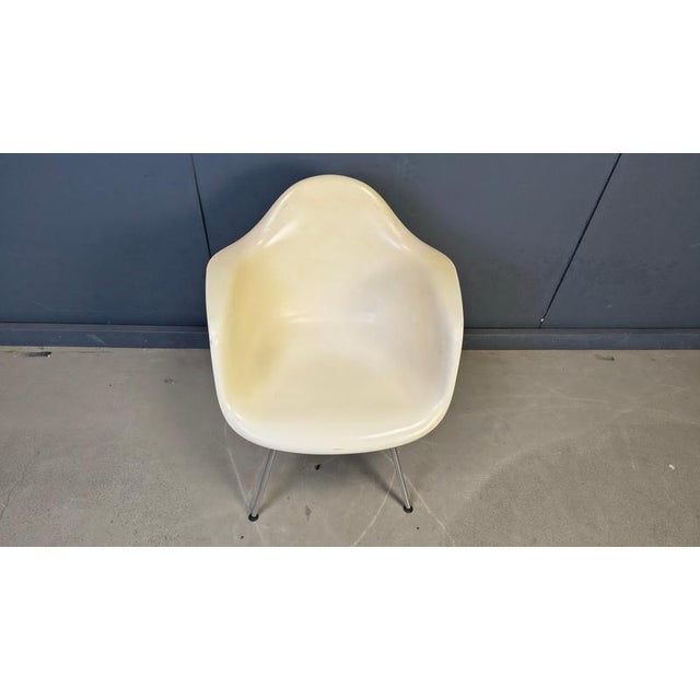 Vintage DAX chair designed in the 1960s by Charles & Ray Eames for Herman Miller, this one produced later in the 1990s by...