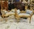 Create a luxurious French-inspired seating arrangement with this matching set of two ornate benches, each featuring an...