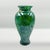 This vase is crafted on the legendary island of Murano, Italy, during the 1960s, this exquisite blown glass vase stands an...