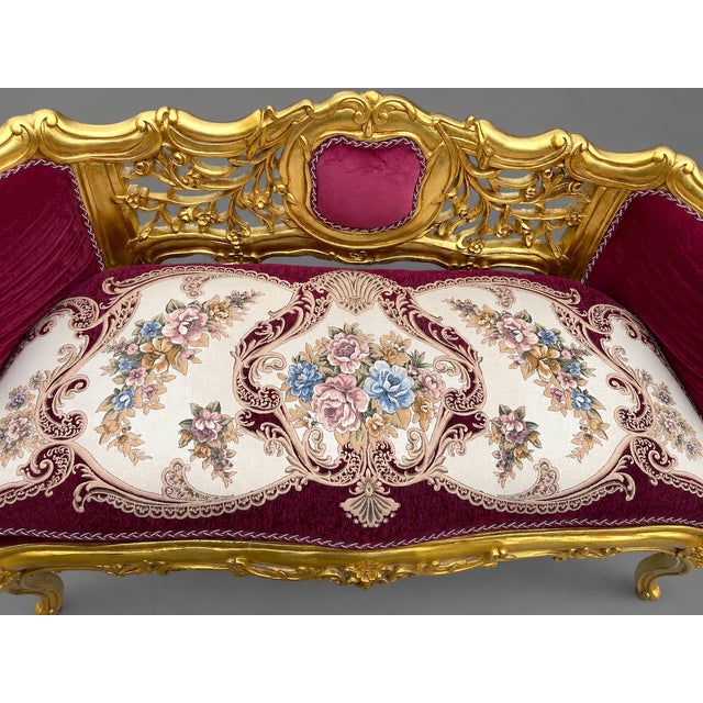 A striking late 20th-century French Louis XVI–style settee, crafted in solid beechwood and finished in a warm gilt gold...