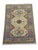 This naturally dyed wool rug features three bold Kazak medallions on a warm beige field. A sky blue border frames the...