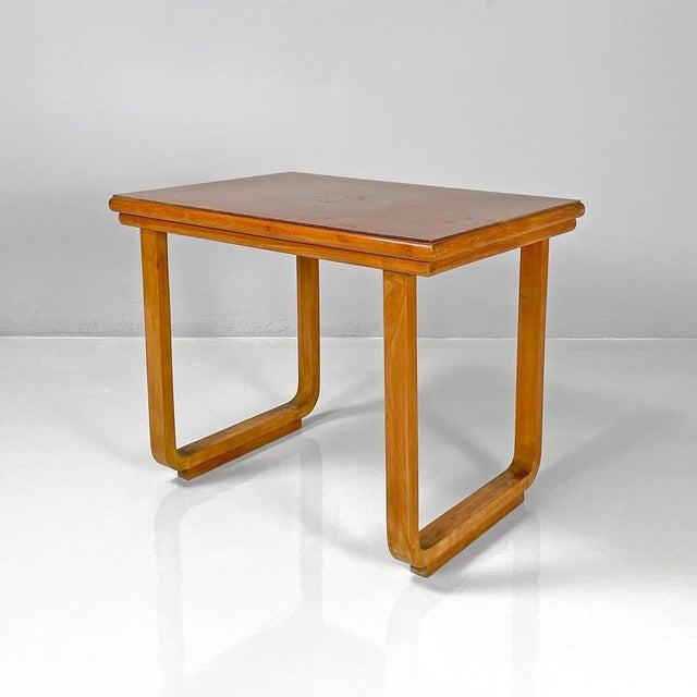 Italian Art Deco wooden coffee table, 1940s Coffee table with rectangular top made entirely of wood. The top has shaped...