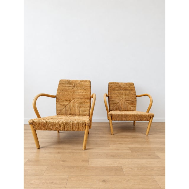 A stunning and rare pair of vintage lounge chairs that perfectly embodies the minimalist, organic, and brutalist aesthetic...