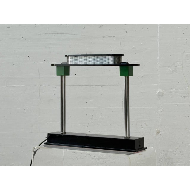 The iconic pausania table lamp by ettore sottsass jr. For artemide dates from the late 1980s. The design impressively...