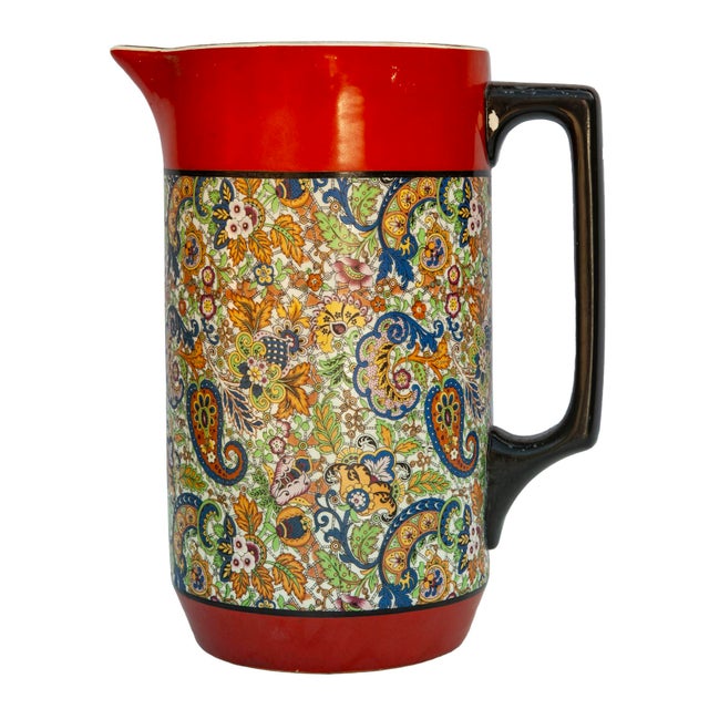 Brilliant tones of intricate paisley German ceramic. Some missing finish on the black trim.