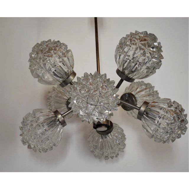 Fancy Sputnik hanging lamp with 8 glass bodies. 8 E14 base. Nickel-plated brass. Very heavy and solid design I have...
