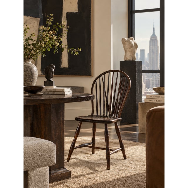 Antique 19th-century brace-back Windsor chair with a tall fan back, slender spindles, diagonal braces, and bentwood crest....