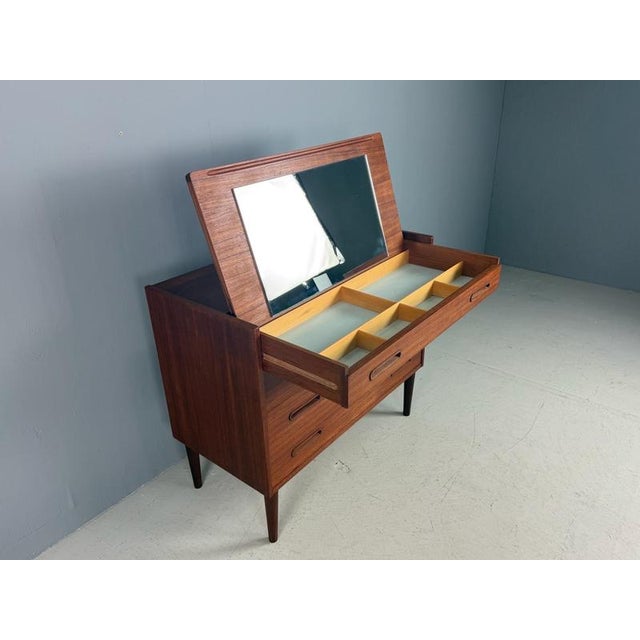 Mid-Century Modern period vanity or make up table also useable as a desk made in Denmark, 1960. Teak veneer wood with...