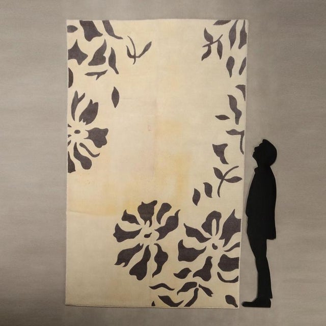 Tailor's floral wool rug, fine knot and hand-made. This piece is attributed to the mentioned designer/maker. It has no...