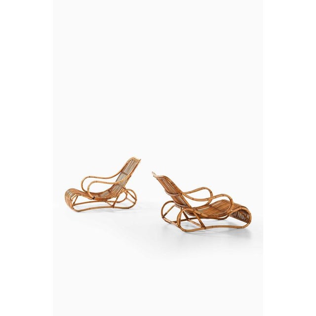 This very rare pair of lounge chairs, attributed to viggo boesen and produced by r. Wengler in denmark, embodies the...