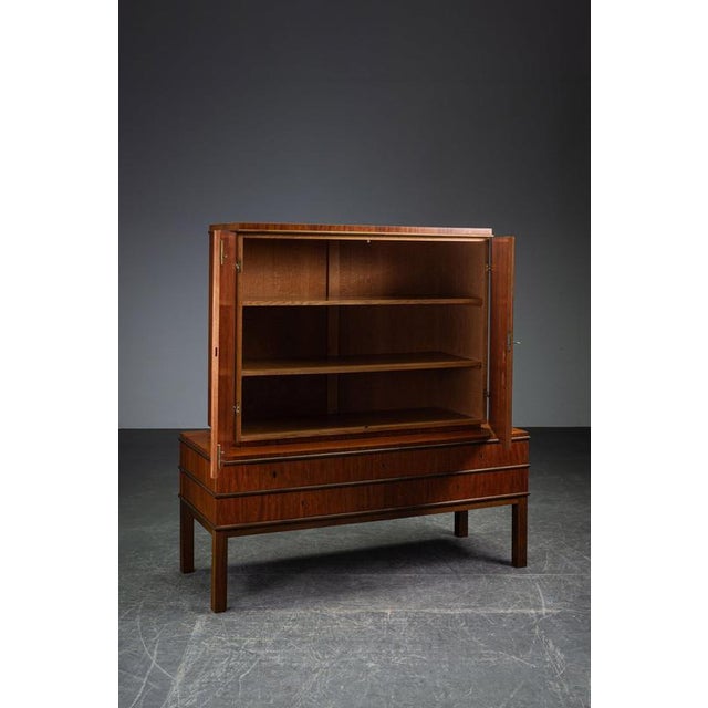1930s Swedish Grace Cabinet period: 1930s origin: Sweden dimensions (cm): h148 x w140 x d55 cm dimensions (inch): h58,27 x...