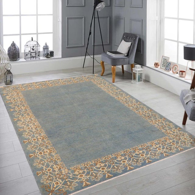 "Enhance the ambiance of your home with this magnificent Persian-influenced Turkish hand-knotted rug made by skilled...